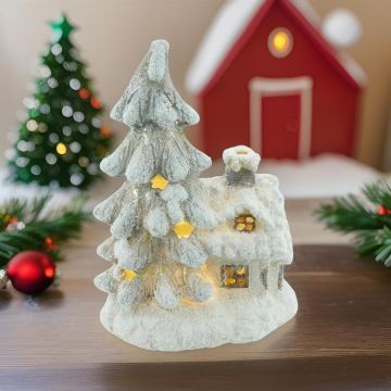 Sneeuw huis met Kerstboom